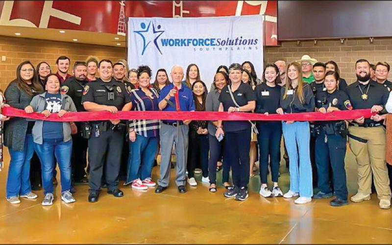 JOB FAIR - The Workforce Solutions of the South Plains hosted the Levelland Job Fair for area 8th graders to visit with local employers about possible career paths. Over 30 employers participated and 300 8th graders from various schools within the area attended the event. Pictured is the Levelland Chamber of Commerce hosting a ribbon cutting with the vendors including Workforce Solutions who were all present at the event. The job fair was held at the Mallet Event Center. (Photo courtesy of Mary Siders)