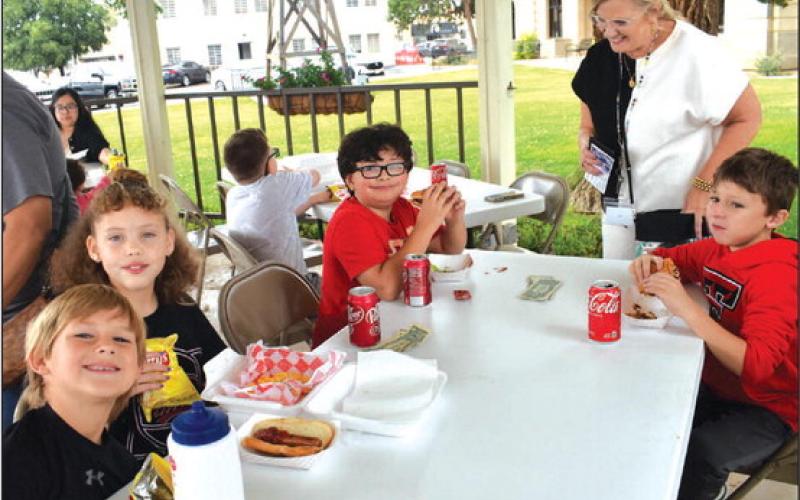OUTDOOR FUN - Miss Utley’s Class from Capital Middle School GT 3rd grade class were out at the Hockley County Court House Gazebo on Thursday doing their project about food trucks. Pictured in no particular order are: Morgan Cambell, Kale DeArmond, Qynley Winn, Bryan Jordan, Herisson, Randell, Eric Rendon.(Staff photo by Emily Campos)
