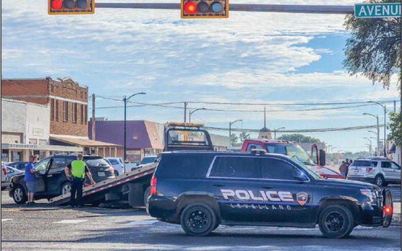 DOWNTOWN WRECK - The Levelland Police Department responded to a report of a two-vehicle wreck that occurred at the intersection of Avenue H. According to officers on the scene, no injuries were reported from the incident. Both vehicles had to be removed from the scene by wrecker services. (Staff photo by Dom Puente)