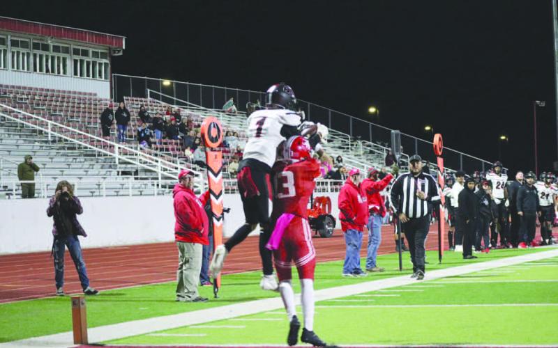 MOSSED - Levelland athlete Ben Alvarado jumped over the Perryton defender to make the amazing grab over him to put the Lobos on the 1-yard line. (Staff photo by Aalijah Soliz)
