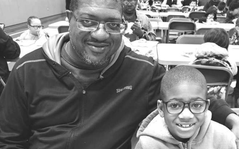 DONUTS WITH DADS- The ABC school had a Donuts with DOGS (Dads of Great Students) Event on Thursday morning at the ABC school. The school takes pride in in all the dads, pops, grandaddy’s, and uncles that come to ABC daily to support the little students learning. When talking to the teachers, they also love DOGS in the their classrooms. The DOGS help in the class room with teaching and helps the parents know what they can help teach there little ones at home to get them a jump start to there leaning.(Photo s