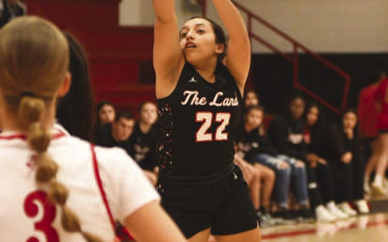 LIGHTS OUT - Levelland Loboette Olivia Velardez shot the ball well against the Sweetwater Lady Mustangs during the teams first district game of the season on Jan 12. (Staff photo by Dom Puente)