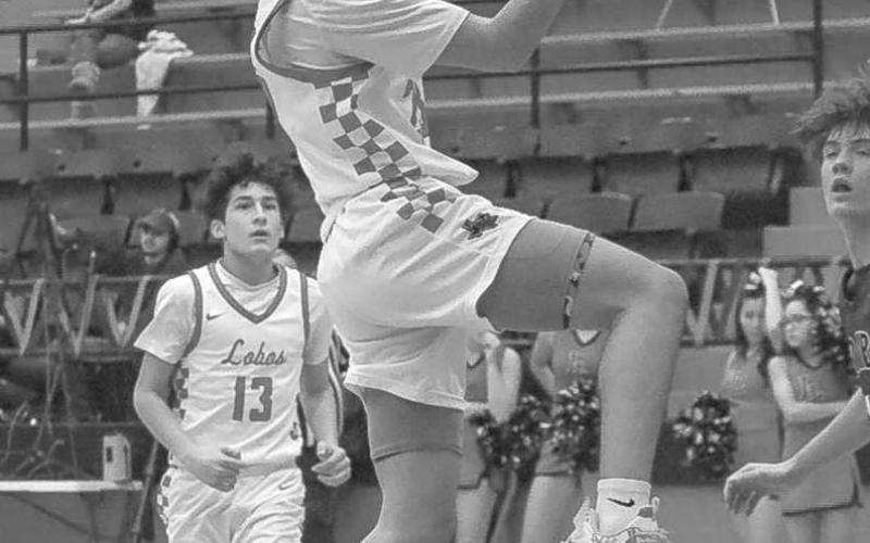 FASTBREAK - Levelland Lobo Ozzie Solano layed the ball up during the teams game against the Lakeview Chiefs in the teams district win last Tuesday night. The teams last game is this Tuesday against the Snyder Tigers on the road. (Staff photo by Aalijah Soliz)