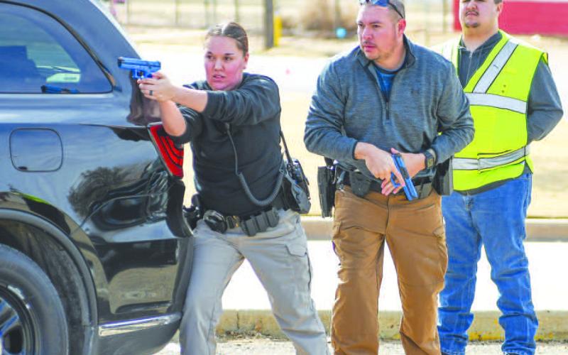 ACTIVE SHOOTER TRAINING - In an effort to provide a new Levelland Police officer and a handful of new South Plains College officers active shooter training to bridge the gap before their ALERRT Level One training in the future, the LPD put together an eight-hour active shooter training module to teach the new officers the basics and fundamentals of navigating these type of incidents. Pictured are officers working on entering the Levelland Intermediate School in a safe manner. (Staff photo by Dom Puente)
