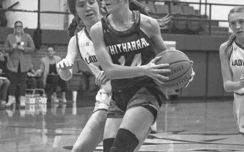 NO EASY SHOTS - Whitharral Lady Panther Paige Smith got out on the fastbreak with Whiteface Lady Lope Hannah Blankenship right behind her to contest the shott. (Staff photo by Aalijah Soli