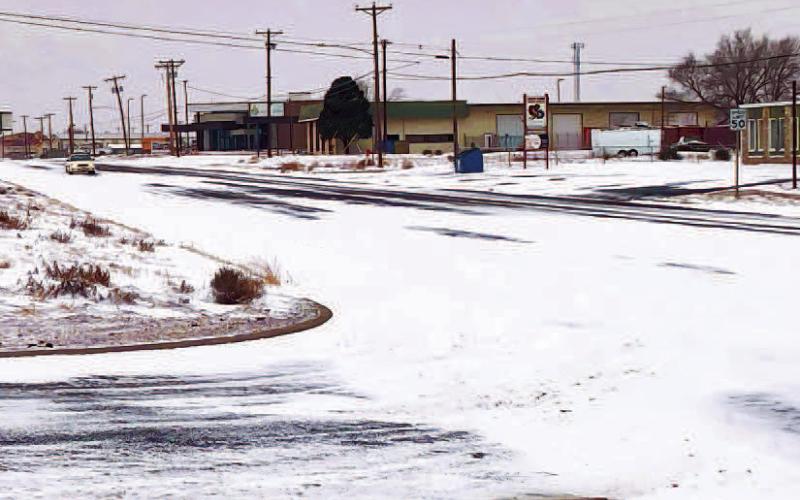 HAZARDOUS ROAD CONDITIONS - Much of the West Texas area including portions of the Panhandle and New Mexico area saw various amounts of snowfall over the weekend heading into Monday. Icy conditions were reported throughout Hockley and Lubbock County cautioning drivers to practice safe driving methods and add extra time for commuting in the early morning of Monday. Various school districts and colleges postponed classes or opted for a 10 a.m. delay. Pictured is the intersection of Highway 114 and Avenue H, Su