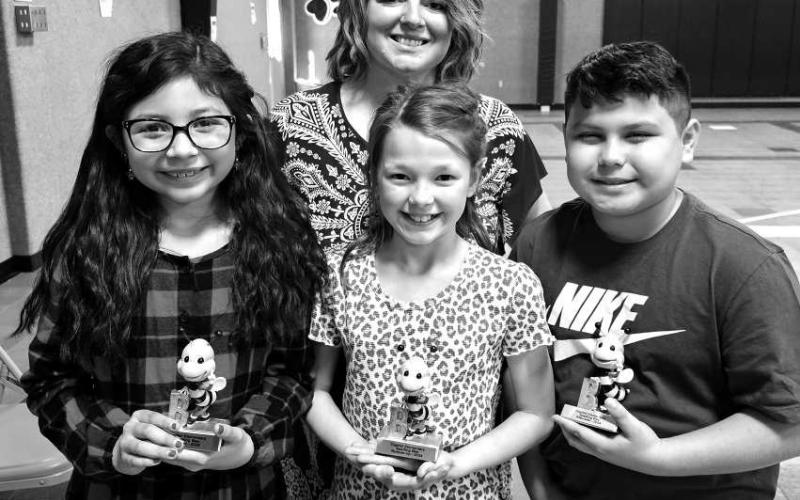 SPELLING BEE - Capitol held their annual spelling bee today that started with 23 third and fourth graders. Fourth grader Brooklyn Escobar won the Capitol Bee by spelling the word nighttime. Fourth grader Micah Favor took home the Runner Up trophy and fourth grader Sebastian Romero was the alternate.. (Photo submitted by Cristal Isaacks)