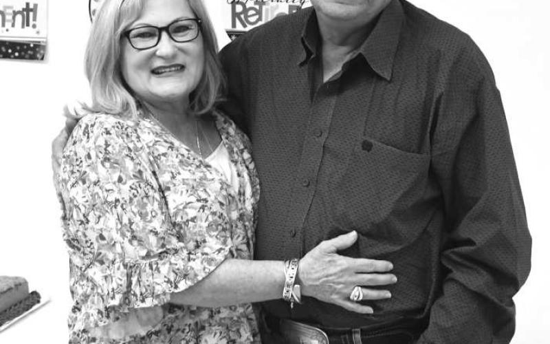 RETIRING- After 18 1/2 years, Bruce Heflin is retiring as Utilities Director for the City of Whiteface. Heflin and his wife Alicia are pictured at a retirement reception at the Whiteface Community Center on April 30. Whiteface Mayor James Soliz thanked Heflin for his years of service, saying, “We’re going to miss him.” Heflin isn’t leaving public service, though. He will remain as chief of the Whiteface Volunteer Fire Department. (Photo by Jay Kelley)