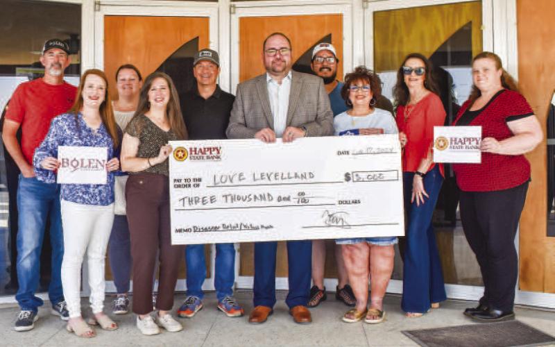 WONDERFUL SUPPORT - The Wallace Theater Board announced the Love Levelland Benefit Concert featuring the Jenni Dale Lord Band, held at Bolen Vineyards raised a total of $7,300 in support of Love Levelland’s vital community initiatives. Pictured from the front row, left to right are: Alycyn Keeling, Tania Moody, Trey Saldana, Lee Ann Paxton. In the back row, from left to right are: Rowdy Bolen, Jolenna Carter, Dallas Pena, Randal Ramirez, Iris Keeling and Tina Wiiest. (Staff photo by Emily Campos)
