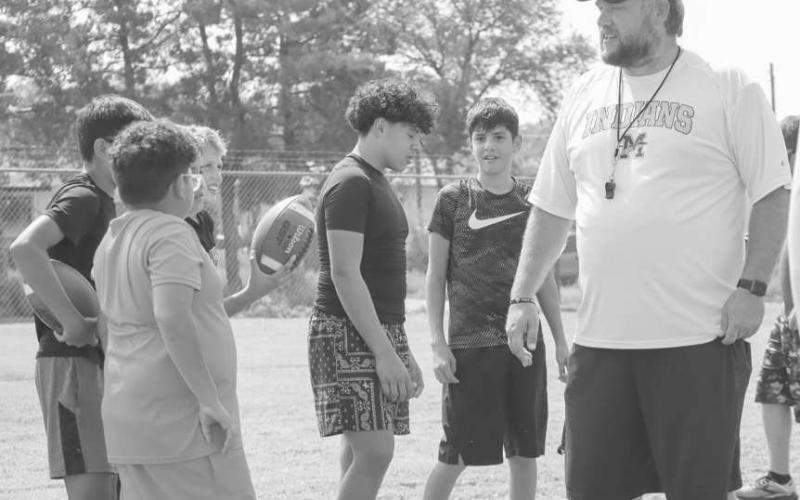 COACHING - Morton Coach was teaching the kids how to do some lineman drills this past Thursday at the Morton High School where they learned things such as snapping the ball. (Staff photo by Aalijah Soliz0