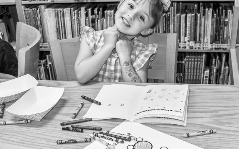 DOODLE TIME - On Wednesday, the Hockley County Library had their summer program event called Doodles and Donuts. Participating was Leslie Scott who has enjoyed the program this summer. Scott said she also has chickens as pets that she enjoys. (Photo courtesy of Emily Campos)