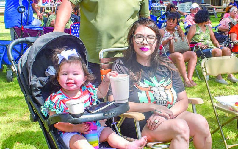JAMAICA FUN-The Munoz family attended the Jamaica in Morton on Sunday that was held by the St. Ann’s Catholic Church. Pictured is Tim and Angelica Munoz and daughter Anali Munoz. (Photo courtesy of Emily Campos)