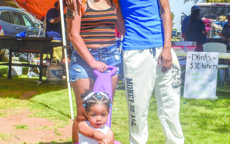 FAMILY FUN-The Duncan family was one of the many families that attended the Jamaica in Morton on Sunday. Pictured is Maria and Mac and daughter Yalanii Duncan. The family enjoyed the various games, music and food booths at the event.(Photo courtesy of Emily Campos)