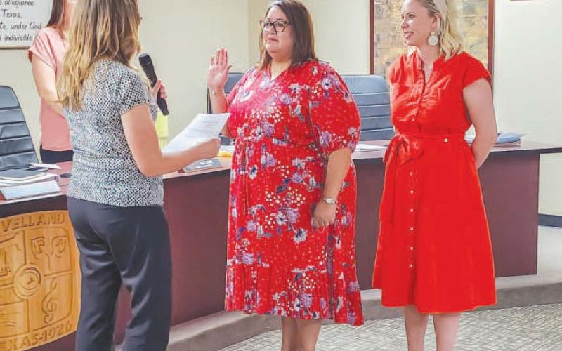 BITTERSWEAT ACCOMPLISHMENT - At the beginning of a special meeting held Monday evening by the Levelland City Council, former Municipal Court Clerk Esmeralda Rowand was appointed as the new municipal court judge following the unanimous approval of the Council. Pictured is City Secretary Andrea Corley administering the Oath of Office to Municipal Court Judge Esmeralda Rowand alongside Mayor Breann Buxkemper. Following her appointment, Rowand thanked the Council for the opportunity as well as thanking her fami