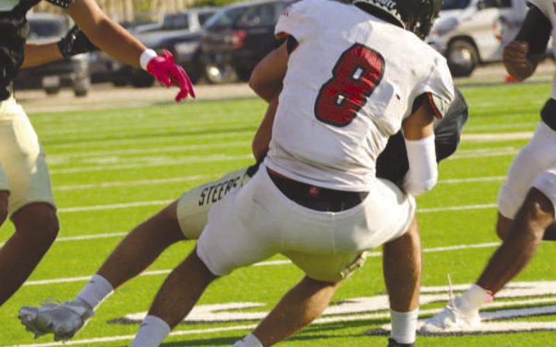 SECURE TACKLE - Levelland Lobo Zaden Carrillo made the wrap up tackle at the line of scrimmage this past Thursday on the road in Big Spring against the Steers. The Levelland Lobos will host the Dalhart Wolves this Friday for their first game of the season. (Staff photo by Aalijah Soliz)