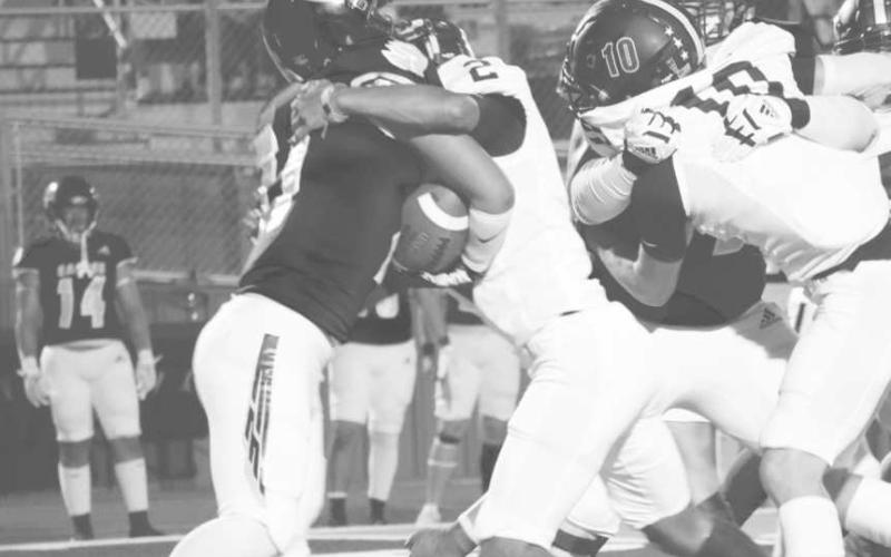 SECURE TACKLING - Levelland Lobo Noah Tienda stopped the Pecos ballcarrier last Friday during the team’s road win against the Eagles. (Staff photo by Aalijah Soliz)