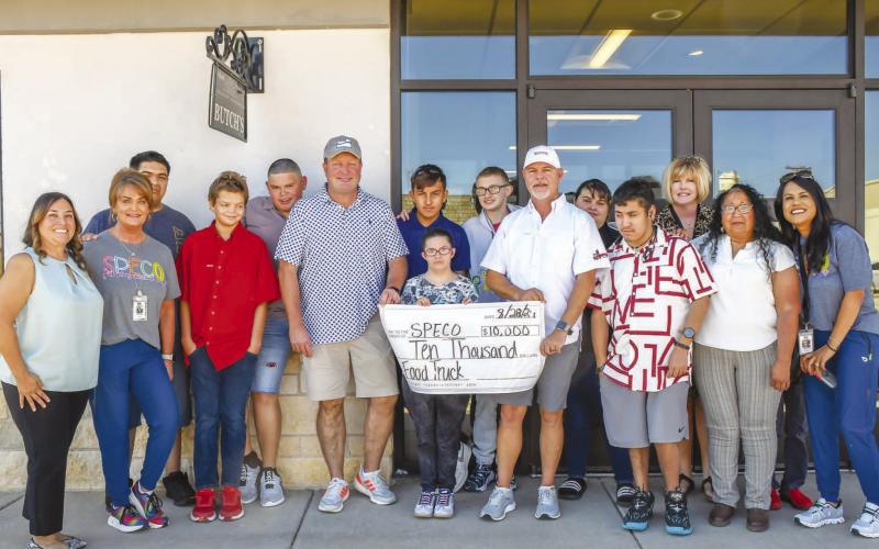 BUTCH’S RAT HOLE DONATION – Butch’s Rat Hole &amp; Anchor Service donated $10,000 for SPECO’s food truck. Pictured, from left to right: Gloria Gamez, Missy Patton, Anthony Avalos, Brendyn Stanley, Diego Alvarado, Scott Bryant of Butch’s Rathole, Anthony Moore, Bobbie Hendon, Donnie Hoover, Mark Franklin of Butch’s Rathole, Jasmine Chino, Elijah Jourden, Keely Kent, Yesenia Maldonado and Cande Jackson. (Staff photo by Evin Thomas)
