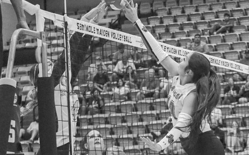 AT THE NET - Levelland Loboette Mia Morin met the Seminole defense at the net to hit the ball over the net last Tuesday on the road. (Staff photo by Aalijah Soliz)