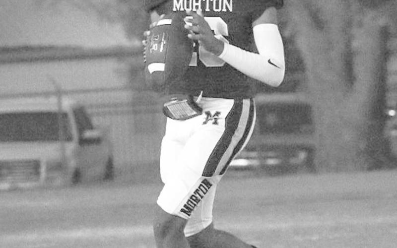 CLEAN POCKET - Morton Indian Brayden Villarreal scrambled out of the pocket scanning down the field this past Thursday night at home against Crosbyton during district play. (Staff photo by Aalijah Soliz)