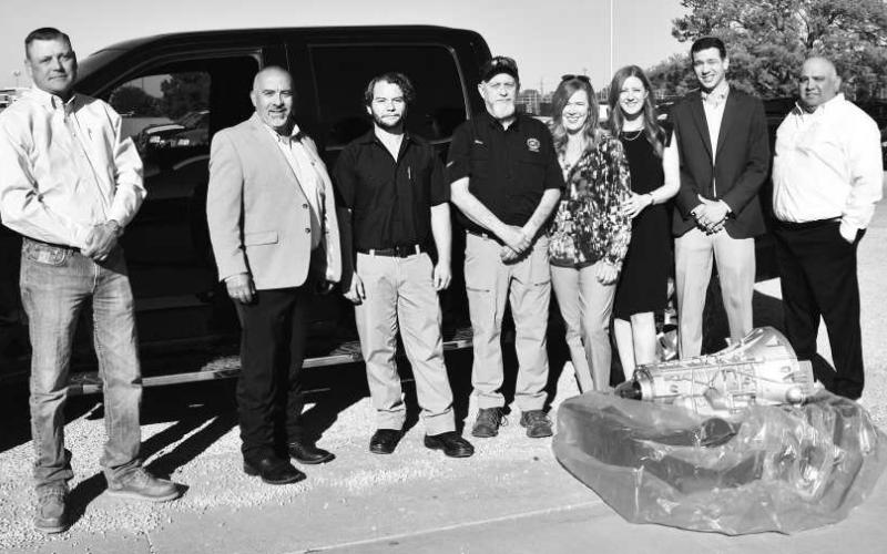 TRANSMISSION DONATION - Smith Auto Family and Ford Motor Company donated a transmission to South Plains College’s automotive technology program on Oct. 15 at the Levelland campus. Pictured from the left are SPC’s Jimmy Stratton, chairperson of the Industrial Technology Department; Albert Garcia, dean of technical education; Shelton Foos, instructor of automotive technology; and Gary Ham, professor of automotive technology; along with Smith Auto Family’s Annette Sykora, dealer principal; Nicole Campbell, gen