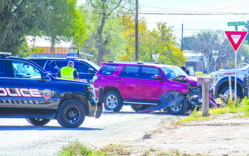 VEHICLE COLLISION - The Levelland Police Department (LPD), Levelland Fire Department (LFD) and Levelland Emergency Medical Services (EMS) responded to the 200 block of Austin Street Friday around noon after a report of a two vehicle collision. Details of the collision are unknown as of publishing. An update will be made when more information is available. (Staff photo by Evin Thomas)