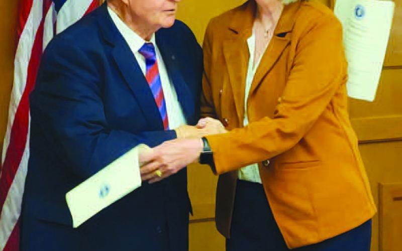 NEW REGENT ADDITON - During Thursday’s South Plains College Board of Regents meeting, Chairman Mike Box administered the Oath of Office to Cathy Mitchell. A story covering the regents meeting will be in Wednesday’s issue. (Staff photo by Dom Puente)