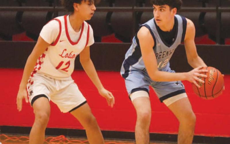 LOCKED DOWN - Levelland Lobo Nehemiah Sanchez made the Greenwood Ranger pass the ball while he guarded him last Tuesday at home. (Staff photo by Aalijah Soliz)