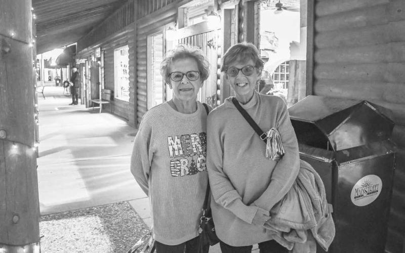 PAIRED UP – Sharon Humphreys and Gay Cummings smiled as they walked along the storefronts in downtown Levelland during Thursday’s Ladies Night Out event. (Staff Photo by Evin Thomas)