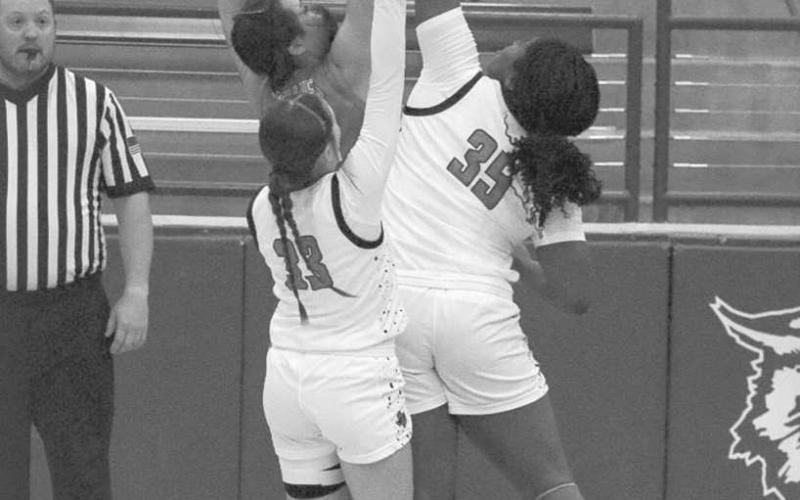 BLOCKED - Levelland Loboette Sydnii Joyce blocked the close shot against the Denver City Lady Mustangs in the Littlefield Tournament. (Staff photo by Aalijah Soliz)