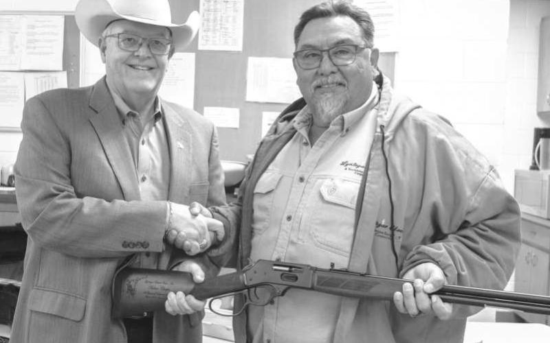 43 YEARS OF SERVICE--Arthur Chapa retired from Lyntegar Electric after 43 years of service. Arthur was gifted a shot gun for his retirement gift. Pictured is Arthur Chapa and Lyntegar Electric CEO Greg Henley. (Submitted photo).