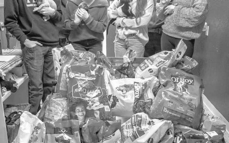NHS SUPPORTS ANIMAL SHELTER - LHS National Honor Society's January Community Service Project was geared towards helping animals. The group bought 420 pounds of dog and cat food for the Levelland Animal Shelter. The NHS Officers: Ethan Parkinson, Emily Perez, Tea Johnson, and Addisen Campbell delivered the food last week. Pictured are Ethan Parkinson, Emily Perez, Tea Johnson and Addisen Campbell with Animal Control Officers Julianna Warnock and Taylor Perez and puppies waiting to be adopted. For more inform