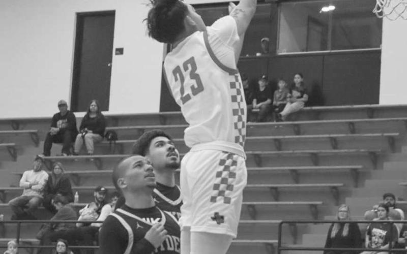 HIGH RISER - Levelland Lobo Ozzie Solano jumped high to get his team a good look during the team’s win against Snyder this past Tuesday night at home. (Staff photo by Aalijah Soliz)