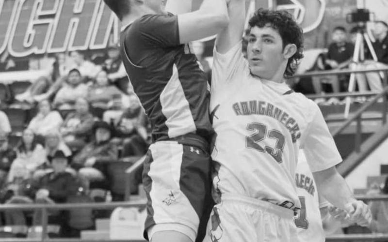 TOUGH SHOT - Whiteface Antelope Ethan Kauffman shot the ball against the Sundown Roughneck Nathan McAdams this past Tuesday night on the road. (Photo courtesy of Holly Crutcher)