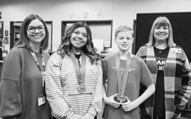 LMS SPELLING BEE WINNERS - Levelland Middle School started off the campus Spelling Bees this past Tuesday. The Spelling Bee started with 21 spellers and went for twelve rounds before Caleb Willey won the Bee spelling, "television." Raeleigh Campos was the runner-up in the Bee. Both of these students will compete again on March 10th at LMS in the LISD District Bee. Pictured from left to right are: LMS Librarian Mixie Clowe, Raeleigh Campos, Caleb Willey and LMS Principal Laurie Jones.