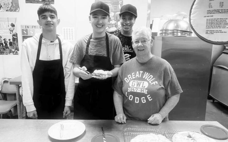 p DAY - LMS celebrated National Pi Day last week. Pi Day is an annual celebration of the mathematical constant p. Pi Day is observed on March 14 since 3, 1, and 4 are the first three significant figures of p. The Lobo Diner students with the help of Mrs Swain made homemade pies. Pictured from left to right are: Adair Miranda, Xavier Castro-Vela, Zalian Williams and volunteer Nancy Swain. (Photo courtesy of Cristal Isaacks).