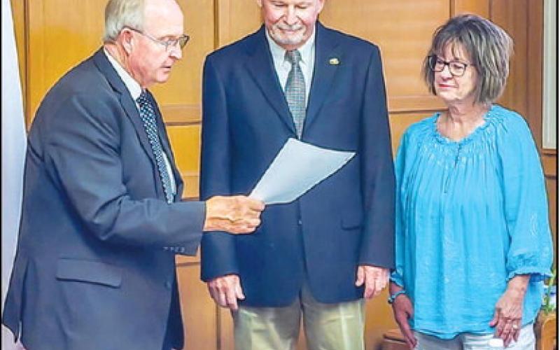NEW SPC REGENT - The South Plains College (SPC) Board of Regents began their monthly regular meeting by appointing and administering the Oath of Office to Pete Stracener. Stracener received unanimous approval from the Regents to be appointed the Position Two Regent. Pictured is Chairman Mike Box administering the Oath of Office to Stracener alongside his wife Cathy. (Staff photo by Dom Puente)
