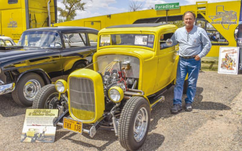 STAR OF THE SHOW – Pictured is Nicholas Olenik showing off a 1932 Ford B owned by Rich Puryear. The car is part of a collection of vehicles from the film American Graffiti, which were featured in the Thunder On the Plains Car Show on Saturday at the Levelland City Park. Puryear also won third in the Non- Fendered Class. (Staff photo by Ada Niederhauser)