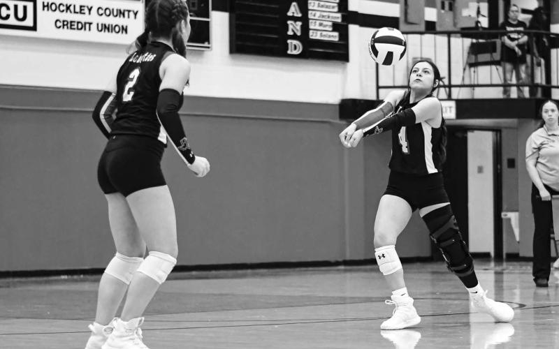 BRACE FOR IMPACT – Senior Yara Carrillos gets in position to play the volleyball while freshman teammate Lola Potter watches during a match at home against Abernathy this past Tuesday. (Staff photo by Jentezen Smith)