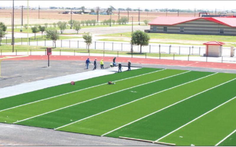 HIGH-PERFORMANCE TURF - Workers began to install the new turf onto the Levelland High School football field. The multi-step installation replaces the stadium's older playing surface with modern, high-performance turf. The new turf comes thanks to Hockley County Credit Union. (Staff photo by Trinity Bourdeaux)