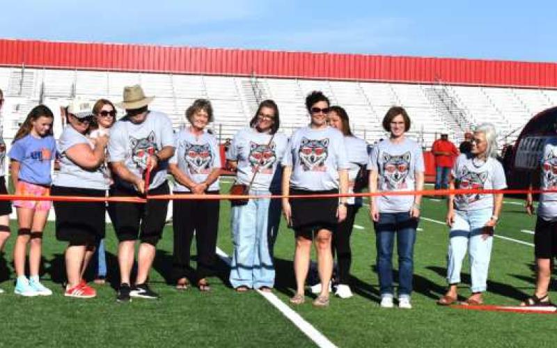 STADIUM RIBBON CUTTING - Hockley County Credit Union and Russell and Angie Vest were joined by HCCU employees for the official ribbon cutting for the Hockley County Credit Union Stadium. (staff photo)