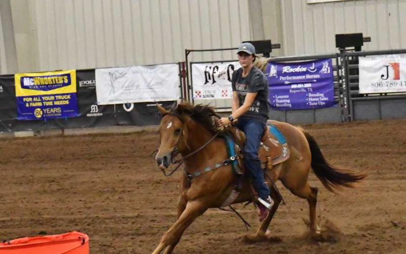 BARREL RACE- Lesley Casper #32 participated in The Betty’s Barrel Race on Saturday at the Mallet Event Center where over 300 participants competed from all over the country. Casper traveled to Levelland all the way from Miami, Florida, where Lesley races all over in the circuit of barrel racing. (Staff photo by Emily Campos)