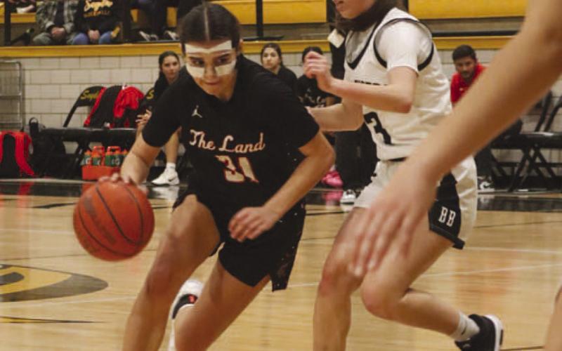 DRIVE IN - Levelland Loboette Leilani Sanchez drove into the paint during the team’s district game against the Snyder Lady Tigers last Friday night. (Staff photo by Aalijah Soilz)