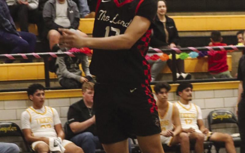 FINGER ROLL - Levelland Lobo Nehemiah Sanchez layed the ball up during the team’s fastbreak in the first half against Snyder for district play. (Staff photo by Aalijah Soliz)