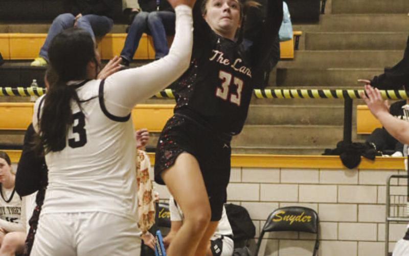 FLOATER - Levelland Loboette Presley Smith shot a floater over the Lady Tiger defender during the team’s game last Friday night on the road. (Staff photo by Aalijah Soliz)