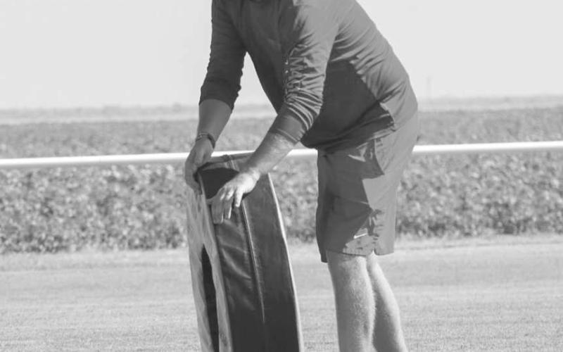 TACKLING WHEEL - Last Monday morning Whitharral Coach Matt White rolled the tackling wheel for the youth at their All-Sports Camp. (Staff photo by Aalijah Soliz)