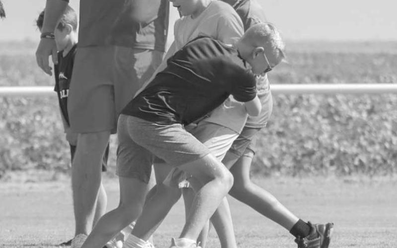 FUNDAMENTALS - Whitharral Panthers Preston Prowell and Brady Holt went over the basics of tackling with each other last Monday at the Whitharral All-Sports camp. (Staff photo by Aalijah Soliz)
