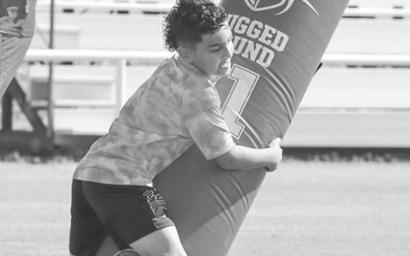 DOWN IT GOES - Whitharral Panther Luke Torrones tackled the dummy last Monday at the Whitharral All-Sports Camp to inprove his form. (Staff photo by Aalijah Soliz)