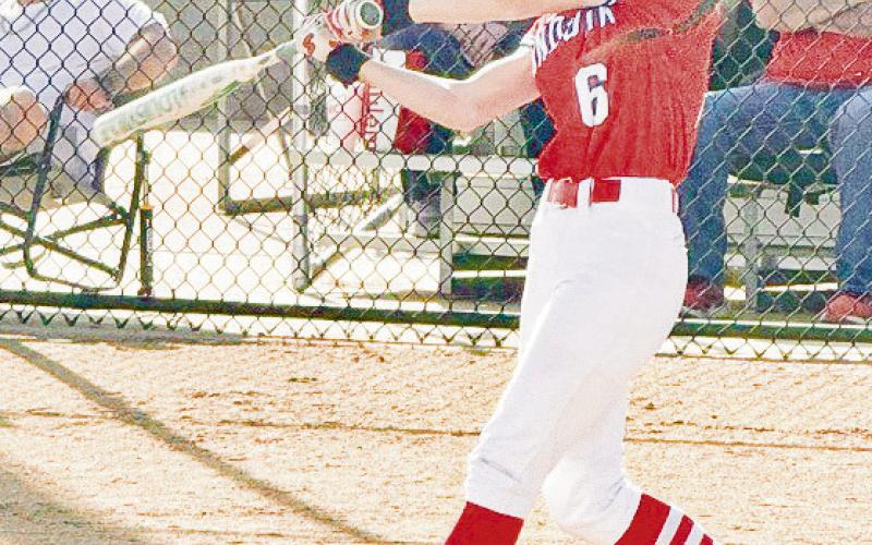 HITTING MACHINE - Sundown Roughette Emry Jourden puts a swing on the softball during their game against the New Home Lady Leopards this past Tuesday night. (Photo provided by Sundown ISD)