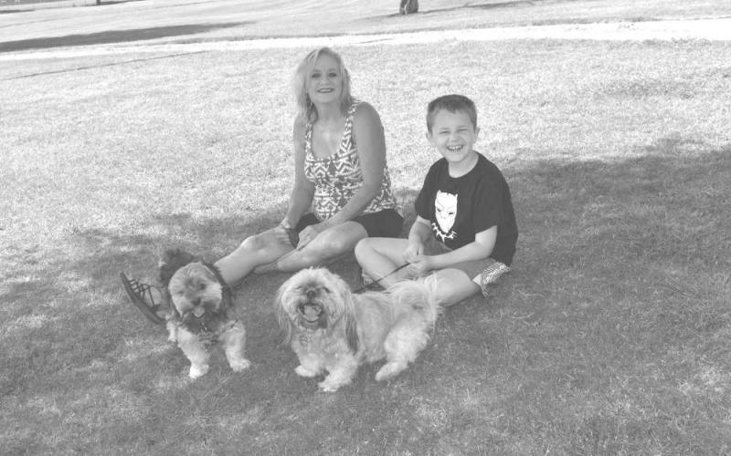 FURRY FRIENDS - Sabrina Scott and her grandson Everett Conawar visited all the way from Maryland and took time to take grandmas furry friends to the Brashear Lake Park. The family spent quality time together and will continue to do so until time for her grandson Everett Conawar to go back home to Maryland. (Staff photo by Emily Campos)