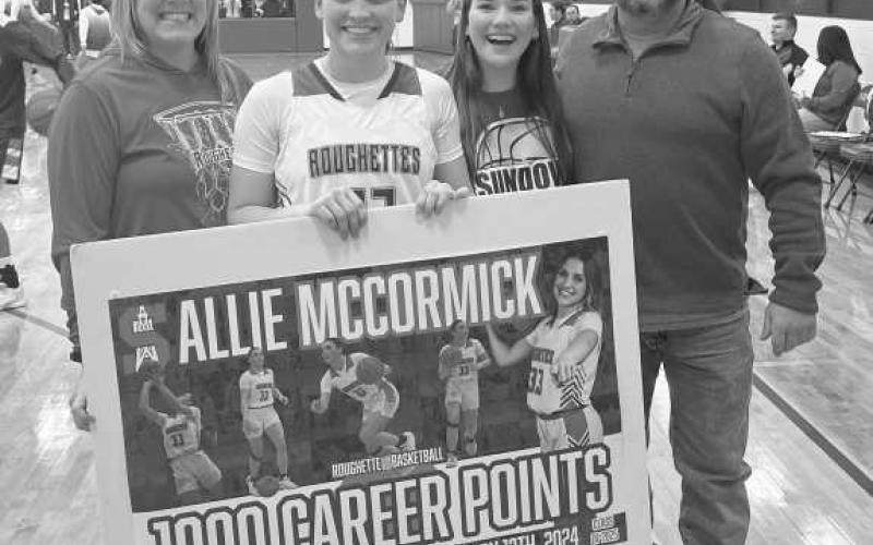 FAMILY - Pictured above is the McCormick family as they cheered on their daughter for earning her 1000th career point against the Tahoka Bulldogs last Friday. Pictured above is Toni McCormick (Mom), Allie McCormick, Ella McCormick (Sister), and Bryan McCormick (Dad). (Photo courtesy of Amber Wisdom)